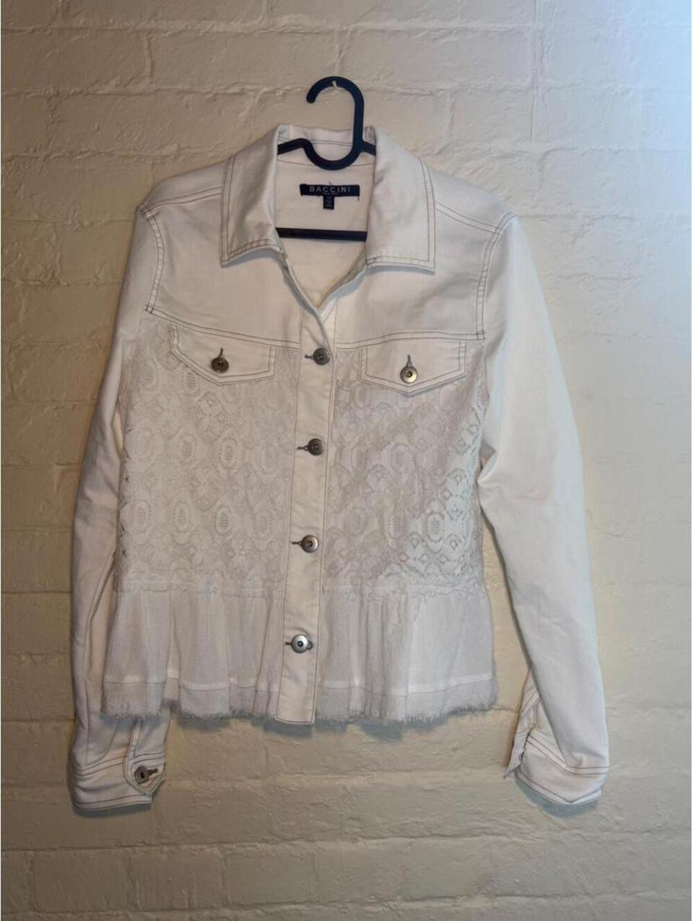 White denim jacket with lace detailing and embroidered floral pattern